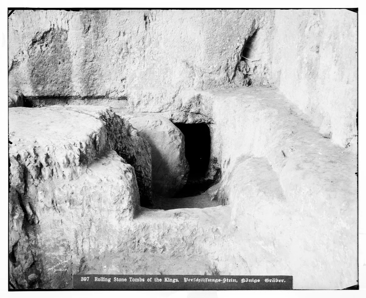 Photograph of the rolling stone at the Tombs of the Kings, Jerusalem: a great disc of rock standing in a channel cut across the tomb entrance.